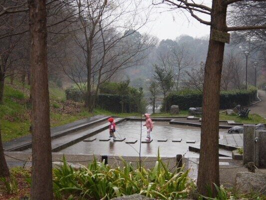 kids playing under the rain